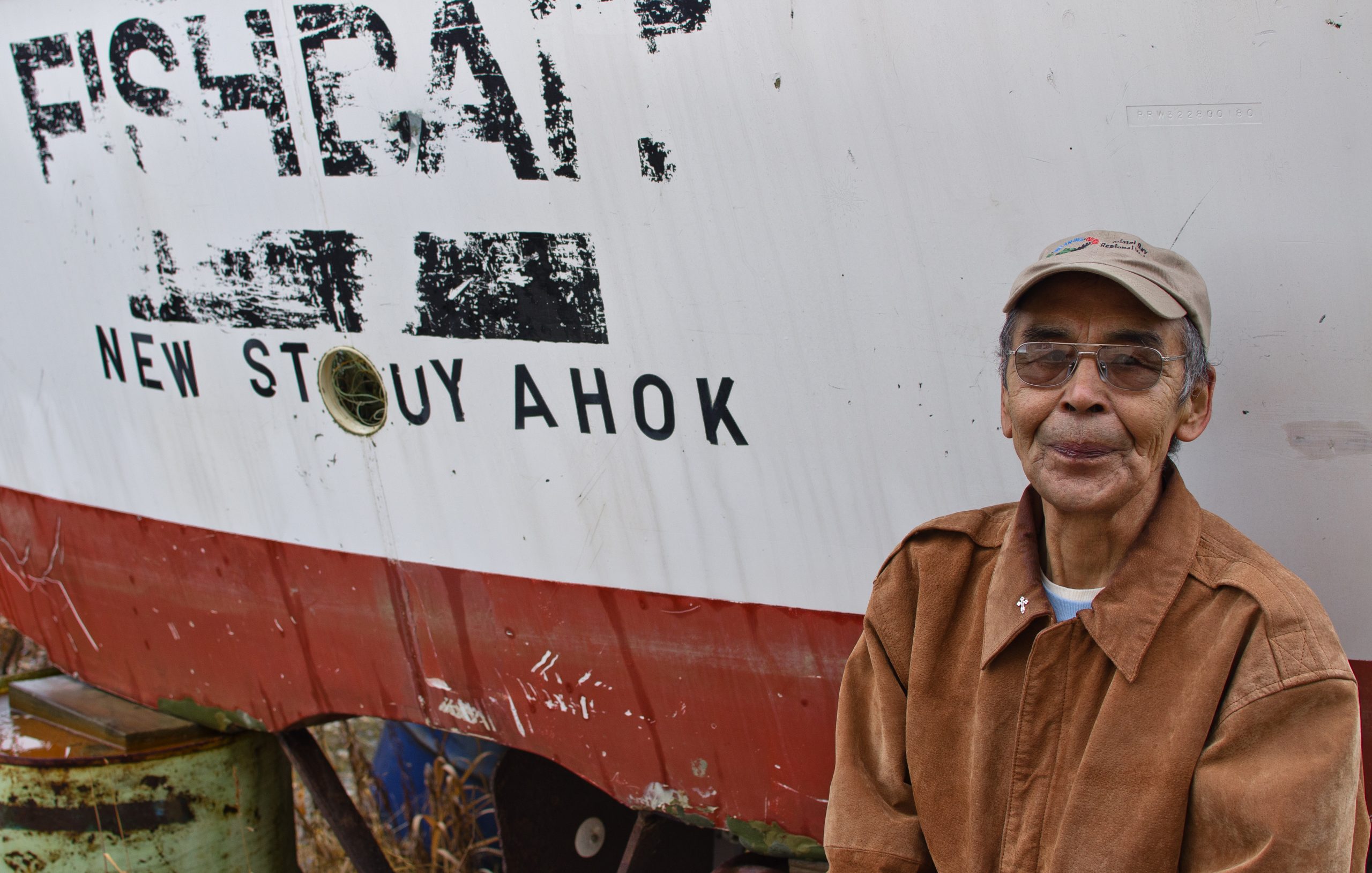 Timothy Winhola by his boat, New Stuyahok, Alaska